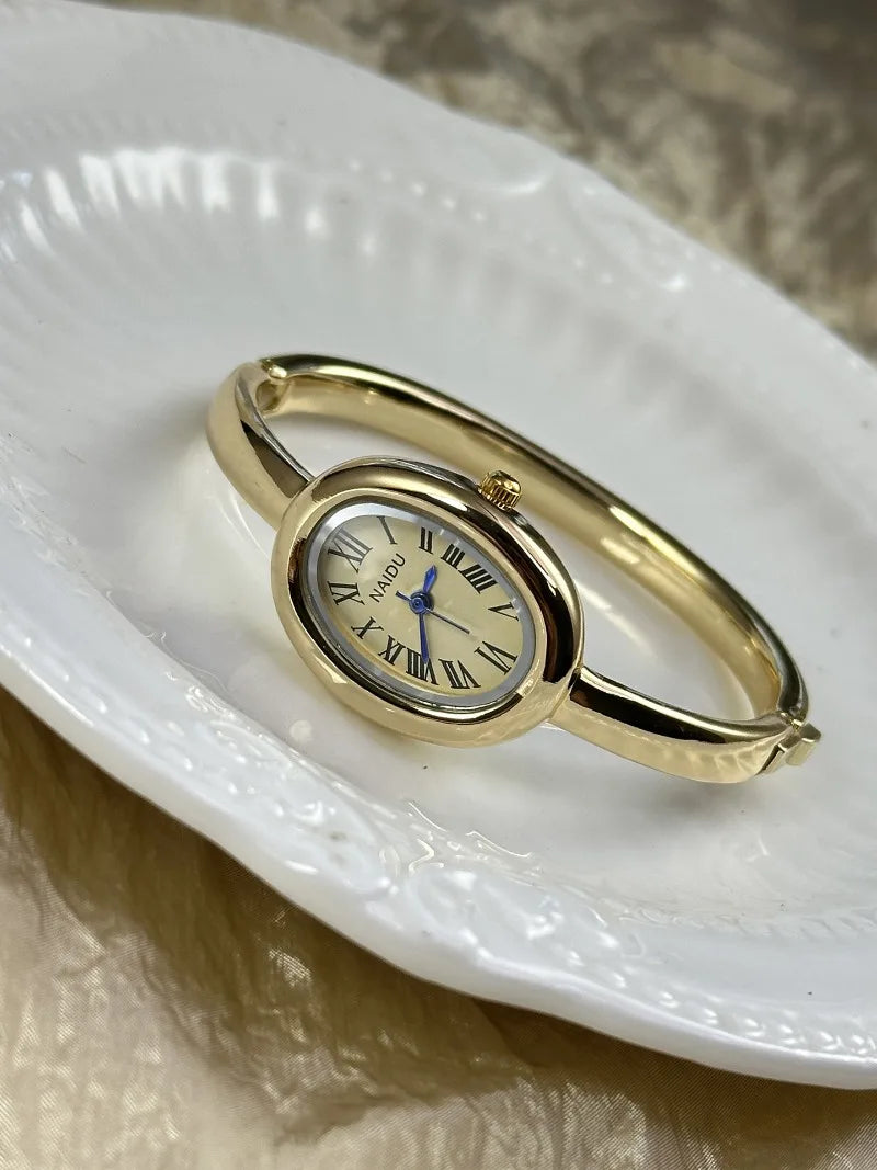Vintage Bangle Watch – Roman Numeral Dial & Classic Oval Design