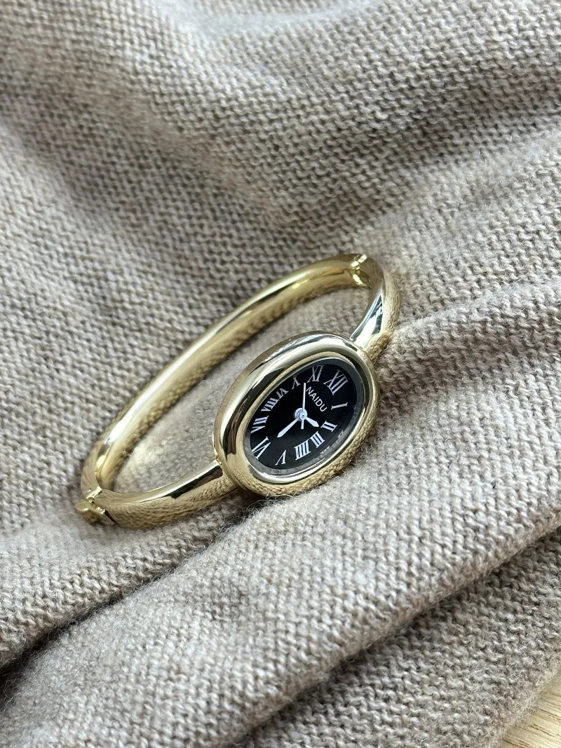 Vintage Bangle Watch – Roman Numeral Dial & Classic Oval Design