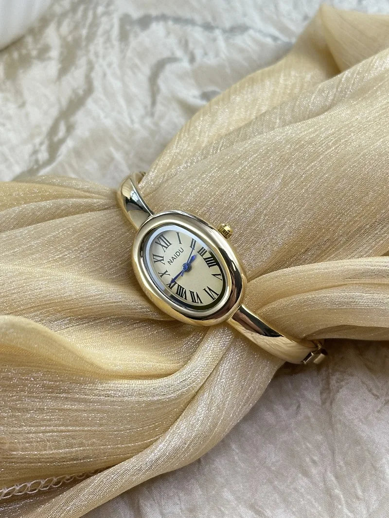 Vintage Bangle Watch – Roman Numeral Dial & Classic Oval Design