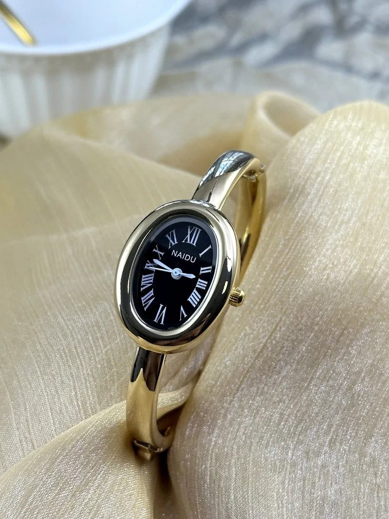 Vintage Bangle Watch – Roman Numeral Dial & Classic Oval Design