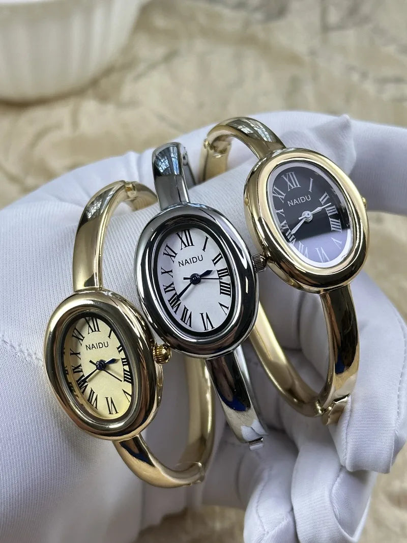Vintage Bangle Watch – Roman Numeral Dial & Classic Oval Design