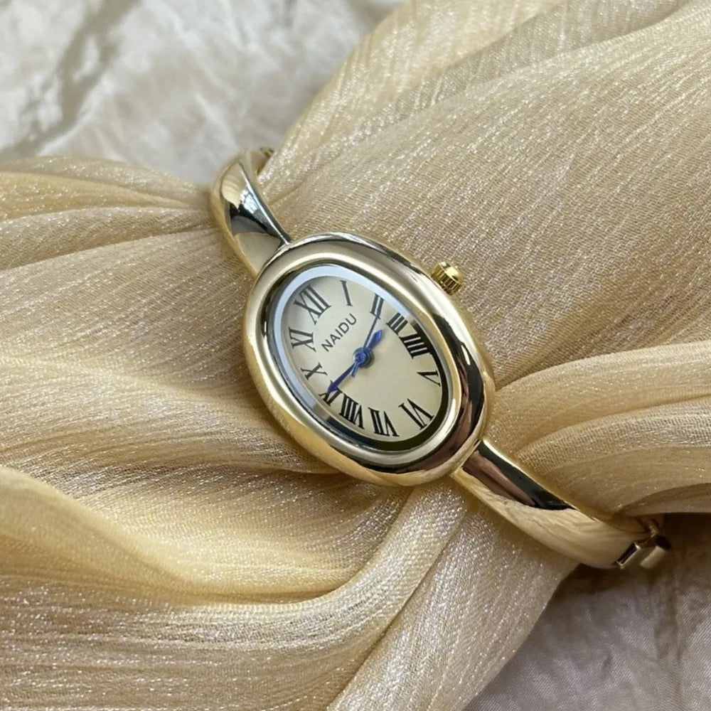 Vintage Bangle Watch – Roman Numeral Dial & Classic Oval Design