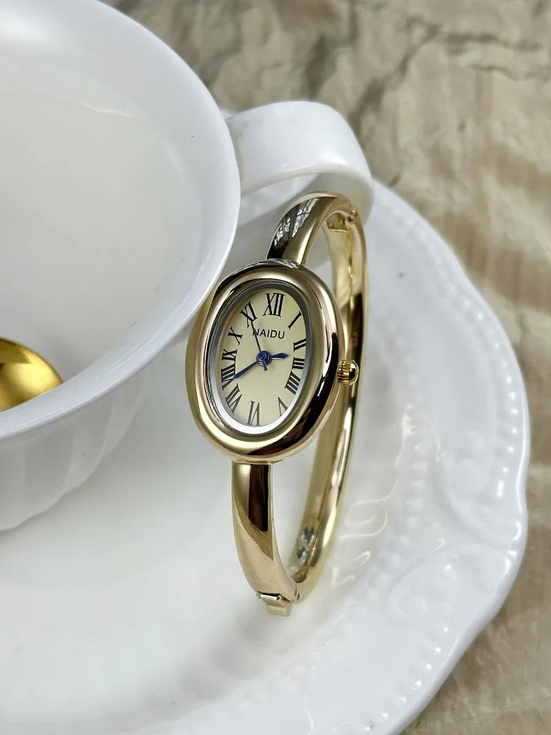Vintage Bangle Watch – Roman Numeral Dial & Classic Oval Design