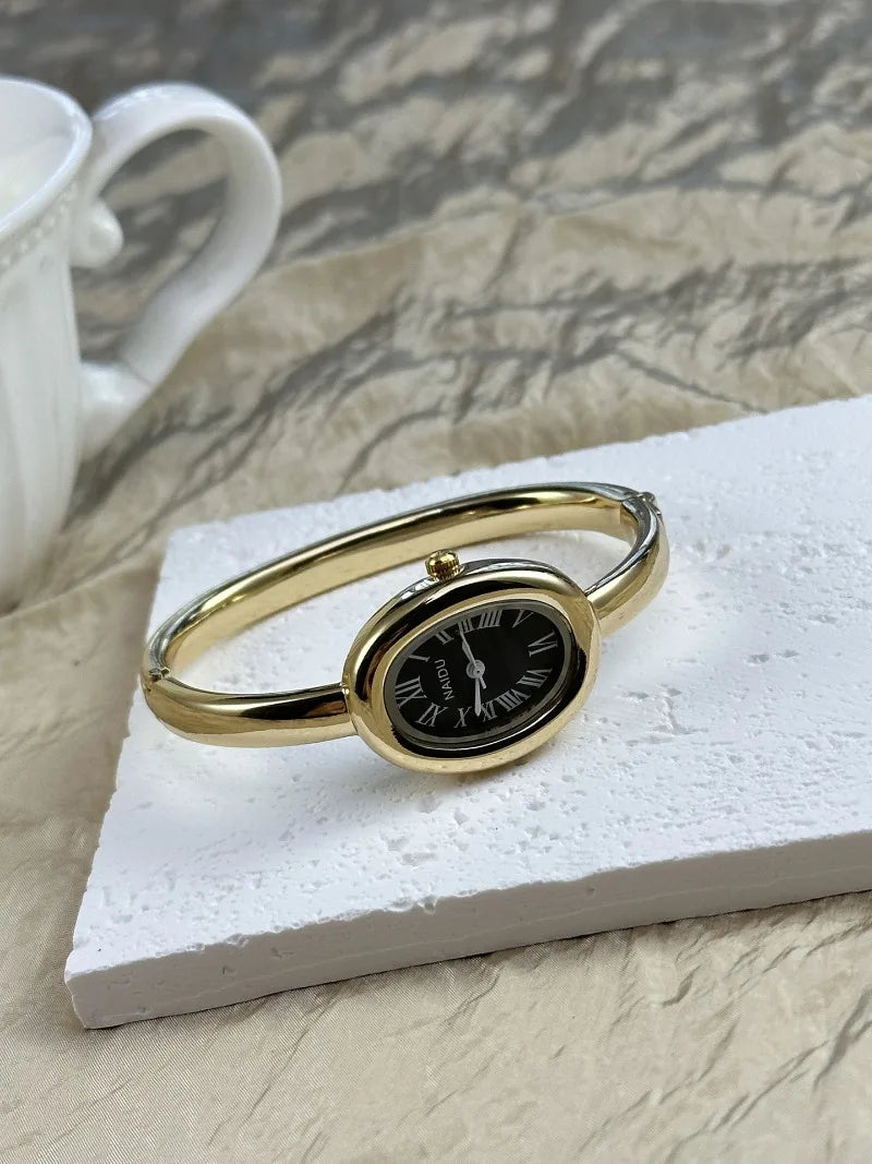 Vintage Bangle Watch – Roman Numeral Dial & Classic Oval Design