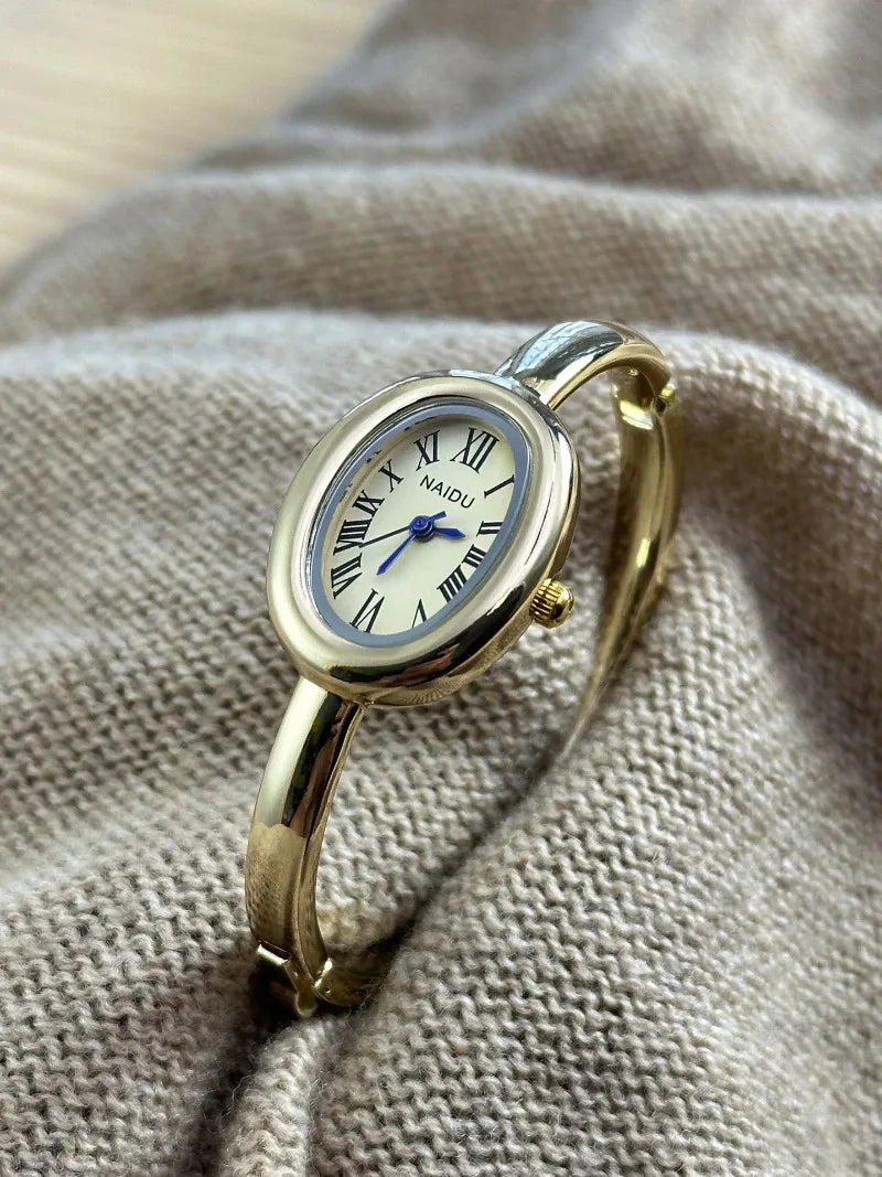 Vintage Bangle Watch – Roman Numeral Dial & Classic Oval Design