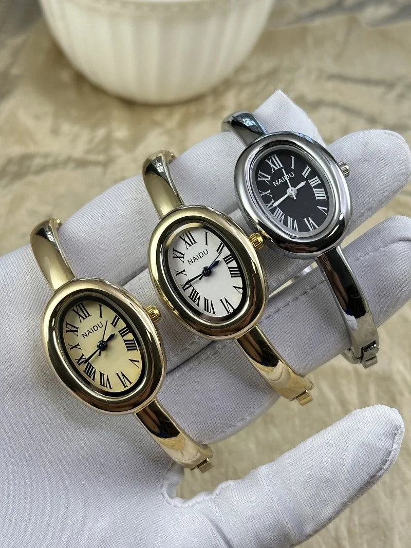 Vintage Bangle Watch – Roman Numeral Dial & Classic Oval Design