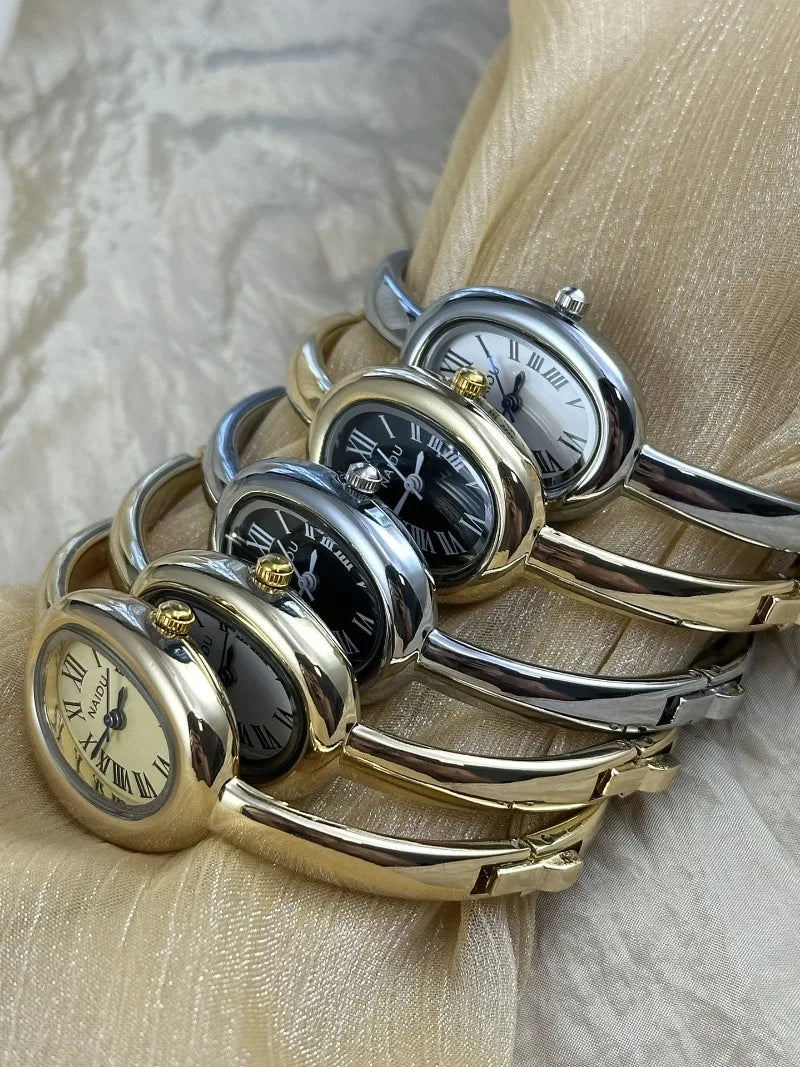 Vintage Bangle Watch – Roman Numeral Dial & Classic Oval Design