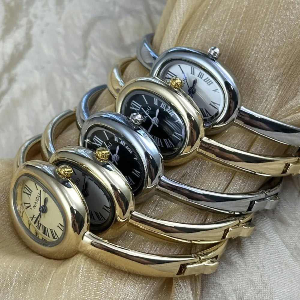 Vintage Bangle Watch – Roman Numeral Dial & Classic Oval Design