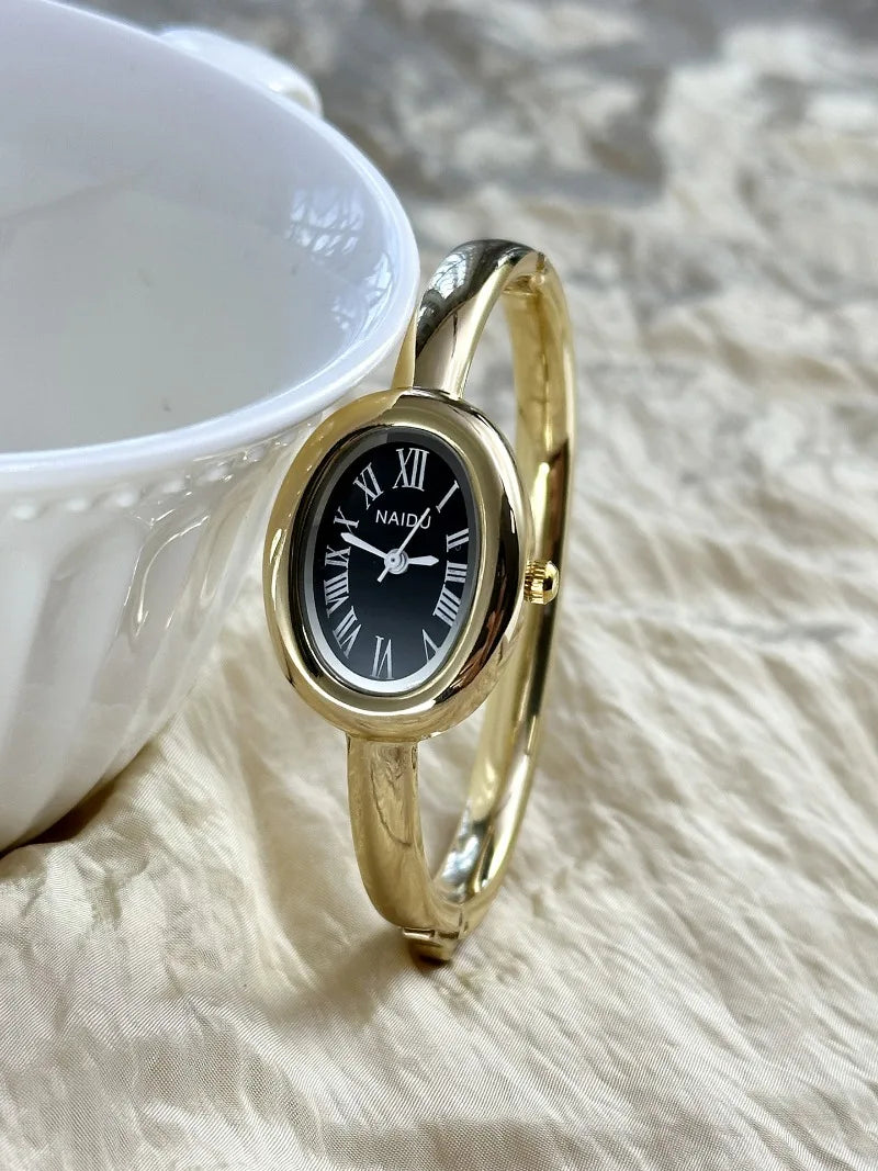 Vintage Bangle Watch – Roman Numeral Dial & Classic Oval Design