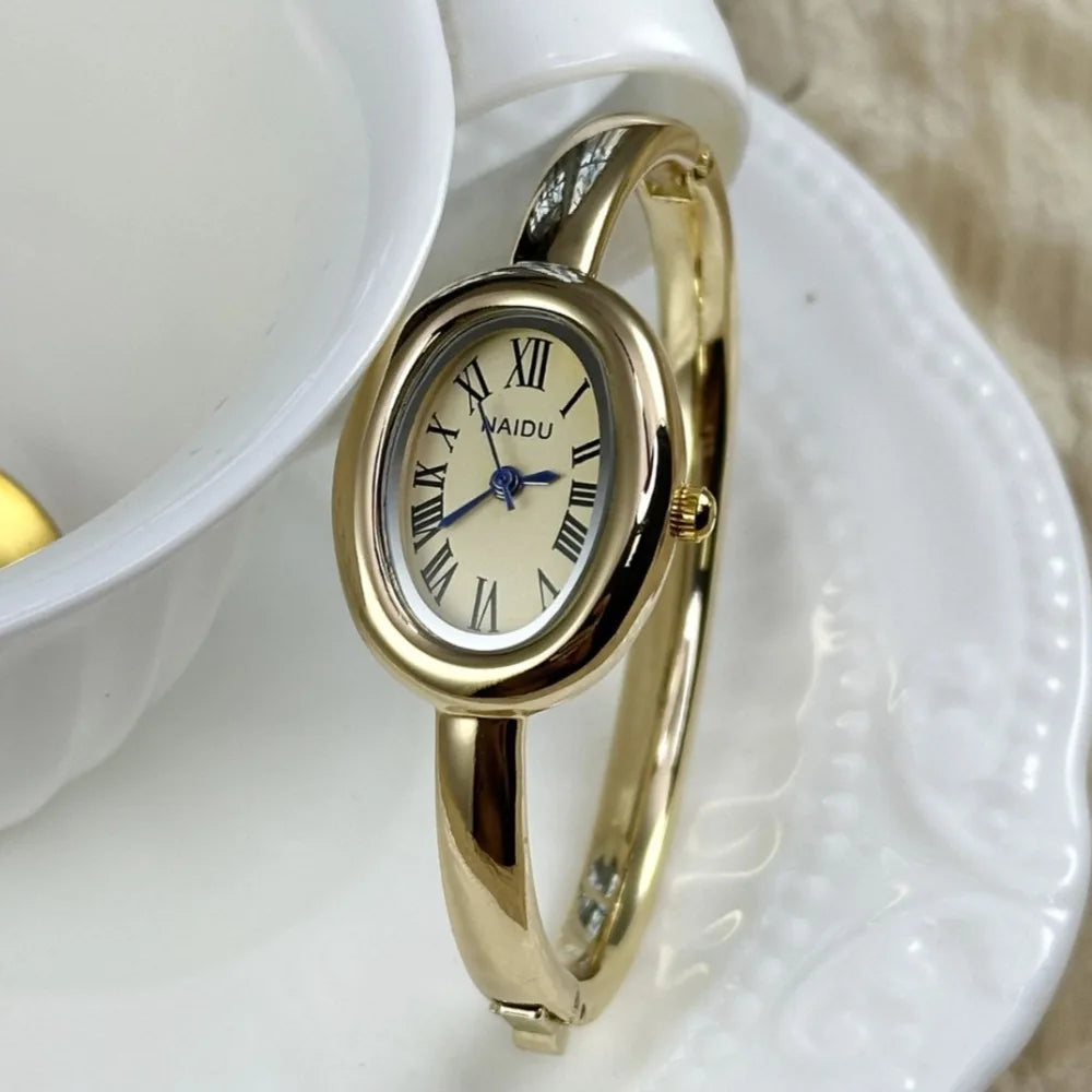 Vintage Bangle Watch – Roman Numeral Dial & Classic Oval Design